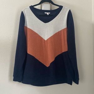 Pink, white, and navy blue sweater.